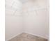 Functional walk-in closet with wire shelving and soft carpeting, providing organized storage space at 9230 Avery Meadows Dr, Charlotte, NC 28216