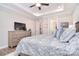 Bedroom features a dresser and tv, closet access, and an ensuite bathroom at 9413 Liberty Hill Dr, Mint Hill, NC 28227