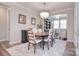 Spacious dining room featuring a chandelier, area rug, and neutral color palette, perfect for formal gatherings at 9413 Liberty Hill Dr, Mint Hill, NC 28227