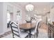 Lovely dining room filled with natural light boasts a large table and French doors leading to the patio at 9413 Liberty Hill Dr, Mint Hill, NC 28227