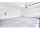 Clean, well-lit two car garage featuring concrete floor and white walls at 9413 Liberty Hill Dr, Mint Hill, NC 28227