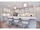 Bright, spacious kitchen features a large center island, modern stainless steel appliances, and stylish pendant lighting at 9413 Liberty Hill Dr, Mint Hill, NC 28227
