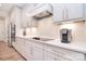 Modern kitchen boasts sleek, stainless steel appliances, and quartz countertops, perfect for the cooking enthusiast at 9413 Liberty Hill Dr, Mint Hill, NC 28227
