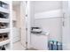 Laundry room with folding station, utility sink, shelving, and a washer and dryer at 9413 Liberty Hill Dr, Mint Hill, NC 28227