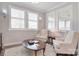 Bright, airy sitting room with shuttered windows and a neutral color palette, creating a relaxing atmosphere at 9413 Liberty Hill Dr, Mint Hill, NC 28227