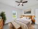 Bedroom with furniture, ceiling fan, window, neutral walls and floors at 1067 Old Charlotte Rd, Concord, NC 28027