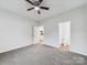 Bedroom with ensuite featuring a ceiling fan, and neutral paint at 1067 Old Charlotte Rd, Concord, NC 28027