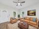 Living room featuring furniture, windows, neutral walls and wood flooring at 1067 Old Charlotte Rd, Concord, NC 28027