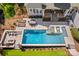 Aerial view of a home showcasing the pool, outdoor seating, and well-maintained landscaping at 115 Brawley Harbor Pl, Mooresville, NC 28117