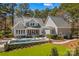 Beautiful backyard featuring a pool, patio area, and well-maintained lawn, perfect for outdoor living and entertainment at 115 Brawley Harbor Pl, Mooresville, NC 28117