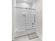 Bathroom with a combined bathtub and shower featuring white subway tile at 115 Brawley Harbor Pl, Mooresville, NC 28117