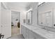 Bathroom with a double vanity, marble countertop, herringbone tile, and glass shower at 115 Brawley Harbor Pl, Mooresville, NC 28117