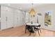 Dining area with modern chandelier, and great storage with white custom built in cabinets at 115 Brawley Harbor Pl, Mooresville, NC 28117