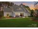 Charming home featuring a manicured lawn and inviting front porch at 115 Brawley Harbor Pl, Mooresville, NC 28117
