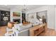 Bright living room featuring a fireplace, built-in shelving, and hardwood floors at 115 Brawley Harbor Pl, Mooresville, NC 28117