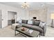 Living room features a sectional sofa, coffee table, and a world map wall decoration at 115 Brawley Harbor Pl, Mooresville, NC 28117