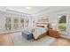 Beautiful main bedroom with large windows, tray ceilings, neutral colors and hardwood floors at 115 Brawley Harbor Pl, Mooresville, NC 28117