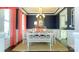 Elegant dining room featuring blue walls, decorative molding, and a white dining set at 116 Fordingbridge Ln, Mooresville, NC 28115