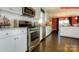 Well-lit kitchen with stainless steel appliances, white cabinets and granite countertops at 116 Fordingbridge Ln, Mooresville, NC 28115