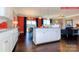 Bright kitchen island with white cabinets and open floor plan to the living area at 116 Fordingbridge Ln, Mooresville, NC 28115