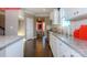 Bright kitchen featuring white cabinets, granite countertops, and stainless steel appliances at 116 Fordingbridge Ln, Mooresville, NC 28115
