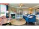 Living room featuring a fireplace, comfortable seating, and plenty of natural light at 116 Fordingbridge Ln, Mooresville, NC 28115