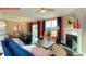 Open concept living and dining area with fireplace and sliding glass doors to backyard at 116 Fordingbridge Ln, Mooresville, NC 28115