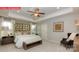 Tranquil primary bedroom with tray ceiling, luxurious bedding, and ample natural light at 124 Fordingbridge Ln, Mooresville, NC 28115
