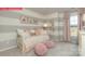 Charming bedroom featuring a daybed, plush pillows, and gray and white striped walls at 124 Fordingbridge Ln, Mooresville, NC 28115
