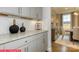 Convenient butler's pantry with granite countertops, subway tile backsplash, and custom cabinetry at 124 Fordingbridge Ln, Mooresville, NC 28115