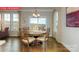 Bright dining room featuring a wood table, with views of the landscape at 124 Fordingbridge Ln, Mooresville, NC 28115