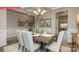 Formal dining room with coffered ceiling, stylish decor, and ample seating for elegant dinner parties at 124 Fordingbridge Ln, Mooresville, NC 28115