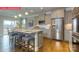Spacious kitchen with granite island, stainless steel appliances, and hardwood floors for modern living at 124 Fordingbridge Ln, Mooresville, NC 28115