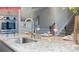 Kitchen island featuring a stainless steel sink and granite countertops at 124 Fordingbridge Ln, Mooresville, NC 28115
