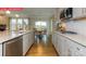 Modern kitchen with stainless steel appliances, granite countertops, and a view to the breakfast nook at 124 Fordingbridge Ln, Mooresville, NC 28115