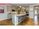 Stylish kitchen boasts granite counters, stainless appliances, and large island with seating at 124 Fordingbridge Ln, Mooresville, NC 28115