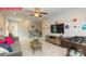 Spacious loft featuring a foosball table, large flat-screen TV, and playful wall decor at 124 Fordingbridge Ln, Mooresville, NC 28115