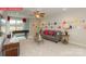 Spacious loft featuring large windows, a comfortable couch, and a foosball table at 124 Fordingbridge Ln, Mooresville, NC 28115