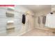 Walk-in closet featuring white wire shelving, neutral carpet, and gray walls at 124 Fordingbridge Ln, Mooresville, NC 28115