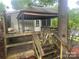 Exterior view of house with a shaded deck at 128 Twin Bluff Trl # C52, Mount Gilead, NC 27306