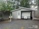 Exterior view of house with gravel parking and a small storage shed at 128 Twin Bluff Trl # C52, Mount Gilead, NC 27306
