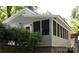 Exterior view of home showcasing a quaint sunroom addition at 128 Twin Bluff Trl # C52, Mount Gilead, NC 27306