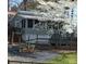 Charming home featuring a well-maintained exterior, complemented by a beautifully landscaped yard and blossoming tree at 128 Twin Bluff Trl # C52, Mount Gilead, NC 27306