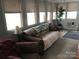 Inviting living room with plenty of natural light and comfortable furniture arrangement at 128 Twin Bluff Trl # C52, Mount Gilead, NC 27306