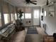 Warm and welcoming living room featuring a ceiling fan, neutral decor and ample light at 128 Twin Bluff Trl # C52, Mount Gilead, NC 27306