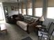 Cozy living room with large windows and plush seating, perfect for relaxing at 128 Twin Bluff Trl # C52, Mount Gilead, NC 27306