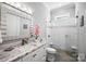 Elegant bathroom features marble countertops, undermount sink and a glass-enclosed tiled shower at 1311 Sunnys Halo Ln, Waxhaw, NC 28173