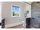 Sleek bathroom featuring a glass enclosed shower and modern fixtures at 1311 Sunnys Halo Ln, Waxhaw, NC 28173