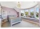 Bright bedroom with a decorative window seat and plush grey carpet at 1311 Sunnys Halo Ln, Waxhaw, NC 28173