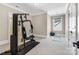 Well-equipped home gym space with exercise machine and natural light at 1311 Sunnys Halo Ln, Waxhaw, NC 28173